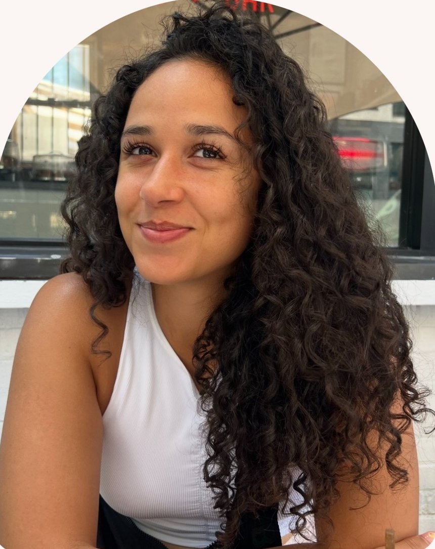 Tiara Gaillard, smiling, with long curly hair